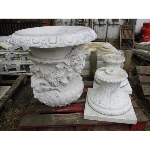 30 - A pair of large marble urns on plinths with classical decoration