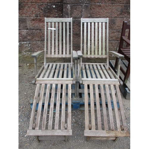 55 - Two teak garden chairs together with a foot stool