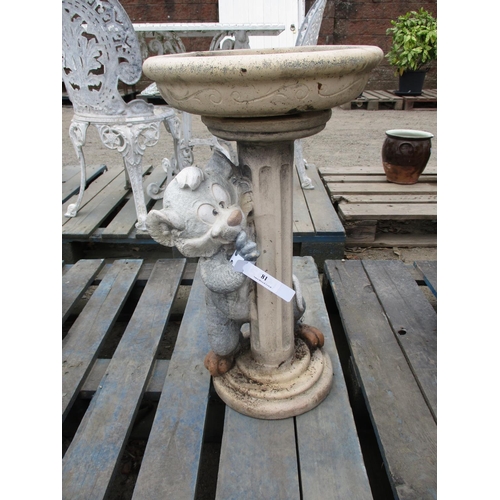 81 - A bird bath with Tom Cat figural decoration