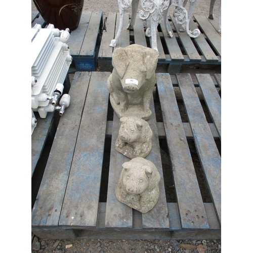 82 - Three reconstituted stone models of pigs