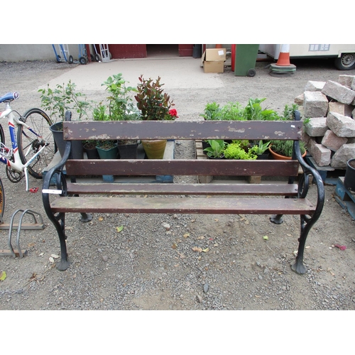 98 - A cast iron and teak garden bench