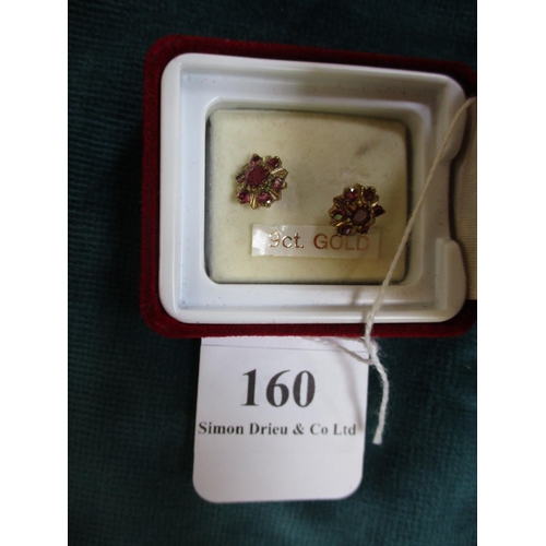 160 - A pair of 9 carat gold and ruby earrings