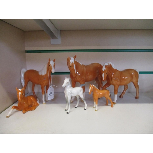 211 - Seven Beswick horses, six Palominos and one other