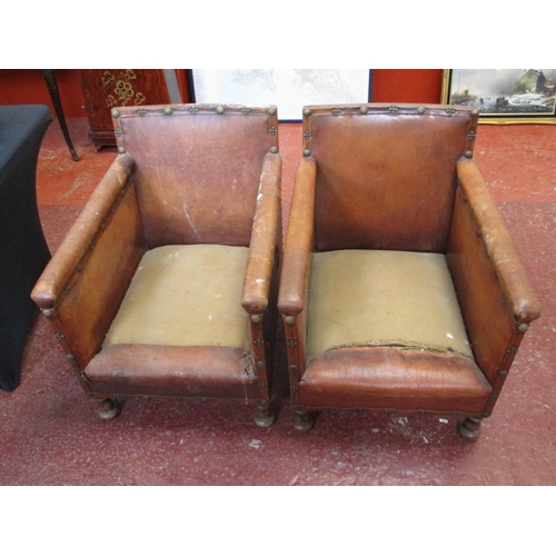 242 - Two leather Arts and Crafts chairs with button back detailing