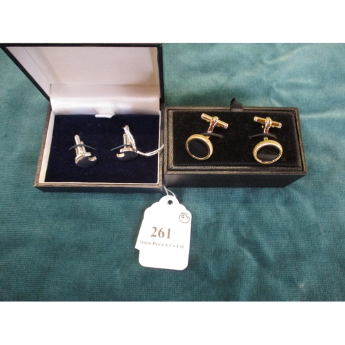 261 - A pair of Alfred Dunhill onyx cufflinks together with a pair of silver moon cufflinks