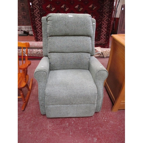 280 - A rising and reclining armchair upholstered in green coloured fabric