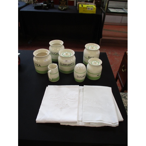 287 - A quantity of vintage Sadler storage jars together with a quantity of linen