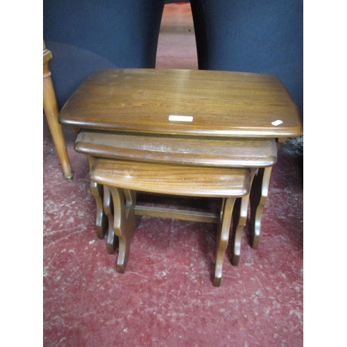 324 - A nest of three graduated Ercol tables