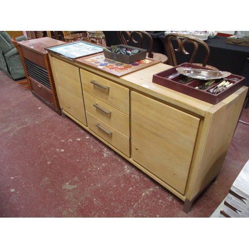 334 - A contemporary beech sideboard fitted three drawers and two doors