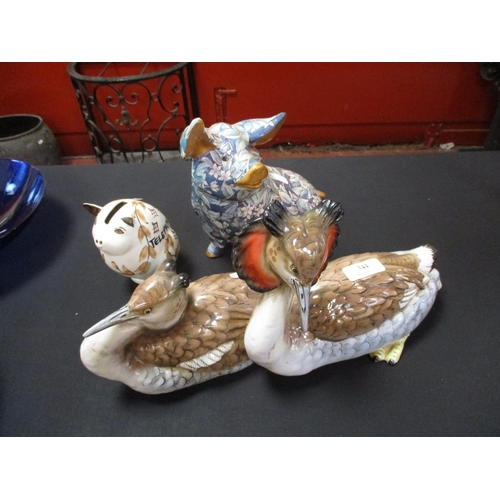 344 - Two ceramic pigs together with an Italian pottery model of birds