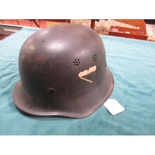 388 - A World War II German factory helmet with unknown decals