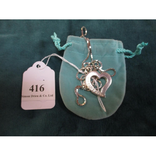 416 - A designer double heart pendant