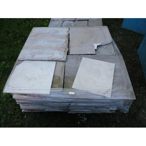 27 - A pallet of sand stone paving