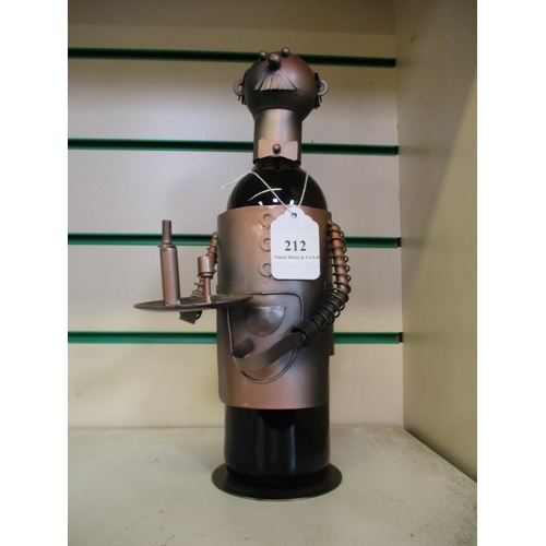 212 - A bottle of red wine contained within a novelty bottle holder modelled in the form of a butler