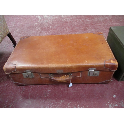 273 - A vintage leather suitcase