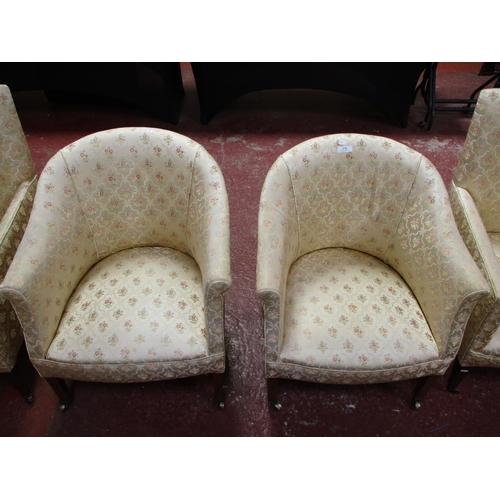 274 - Two pairs of armchairs upholstered in floral and ribbon design gold coloured fabric