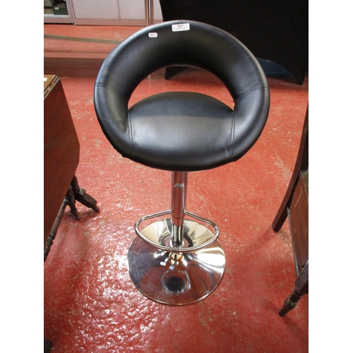 277 - A chrome and faux leather adjustable breakfast stool