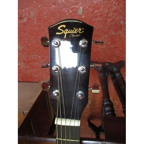 278 - A Squier Fender acoustic guitar and case