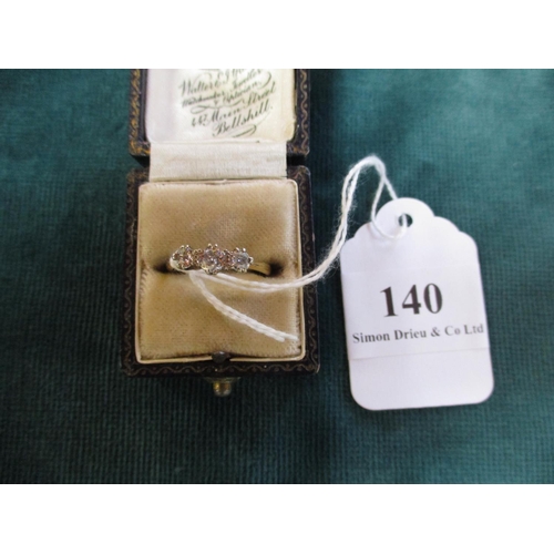 140 - A vintage 18 carat gold three diamond ring (size O)