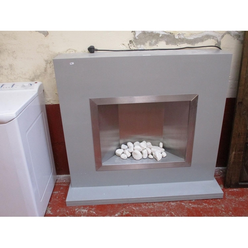 300 - A contemporary fire place containing an electric fire