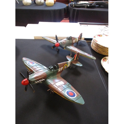 293 - Two tinplate model aircraft, one of a Spitfire the other of a Hurricane