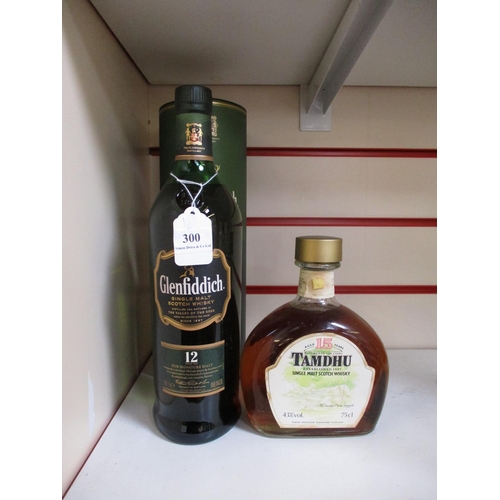 300 - A 1 litre presentation bottle of Glenfiddich single malt Scotch Whisky together with a bottle of Tam... 