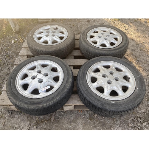 25 - A set of four aluminium wheels and tyres (165/65R14) to suit Subaru Sumo