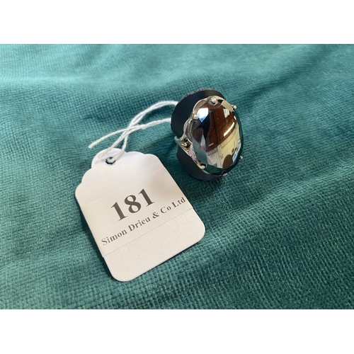 181 - A large sterling silver ring set with a volcanic obsidian - size P