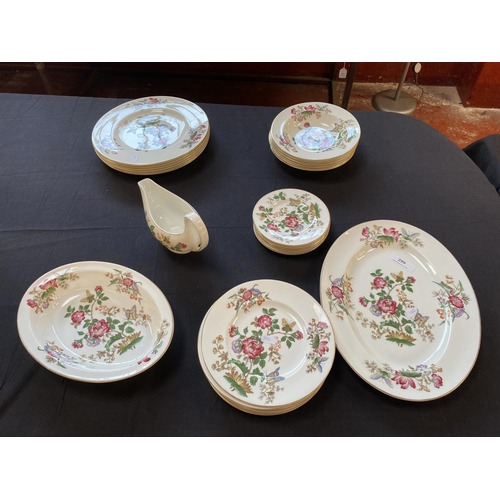 299 - A Wedgwood bone china part dinner service decorated with flowers and insects on a white ground