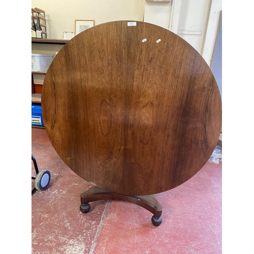 313 - A Victorian rosewood circular single pedestal tilt top breakfast table