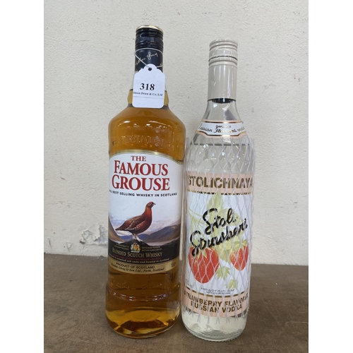 318 - A 1L bottle of The Famous Grouse Blended Scotch Whisky together with a bottle of Stolichnay Strawber... 