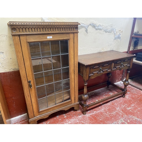 360 - An early twentieth century lead glazed oak display cabinet together with an oak console table