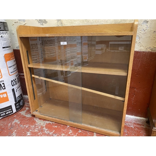 361 - A mid century glazed oak bookcase