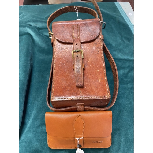 194 - A vintage leather ammunition case together with a leather ammunition pouch