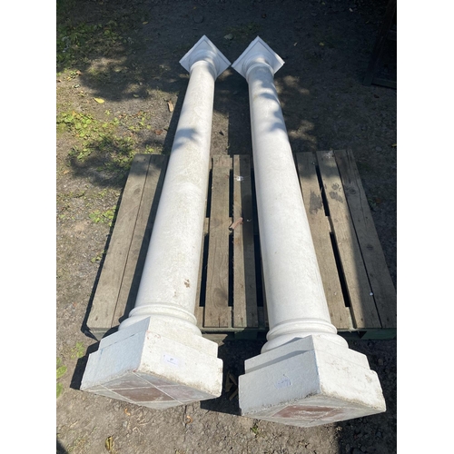 17 - A pair of reconstituted stone circular pillars