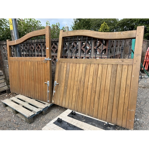 22 - A pair of substantial tongue and groove entrance way gates with metallic spindle inserts and galvani... 