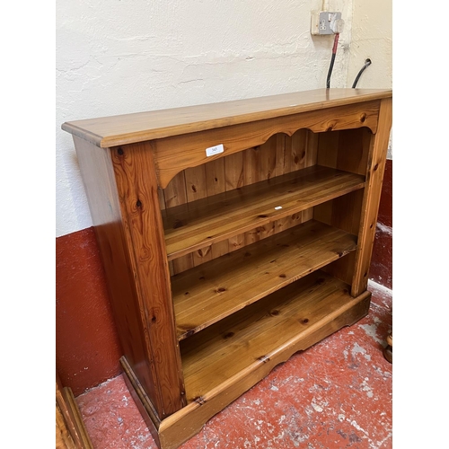 343 - A honey glazed pine three tier open book case