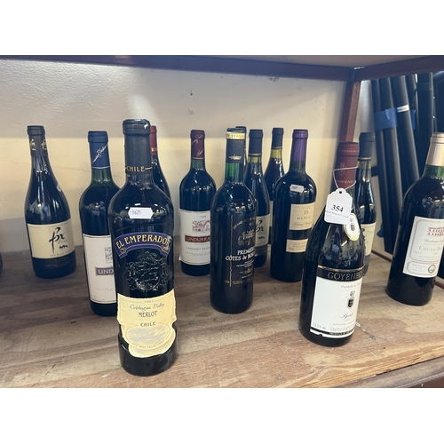 354 - An assortment of red wine together with one bottle of white wine