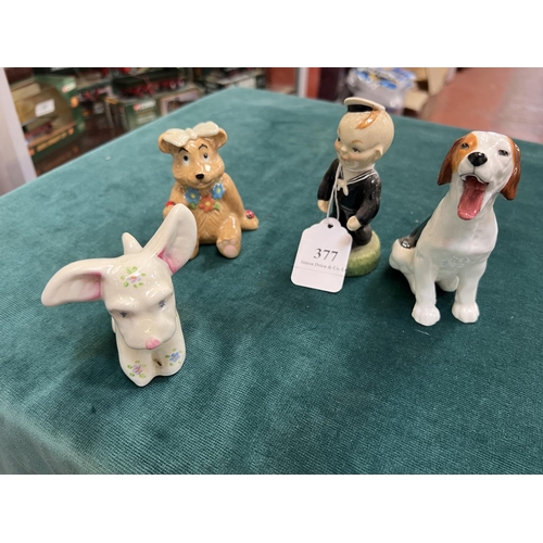 377 - A Carlton Ware sailor, a Royal Doulton dog, a Plichta dog and a Wade bear