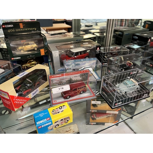 378 - A collection of eleven mint boxed Mini and Morris Minor model cars