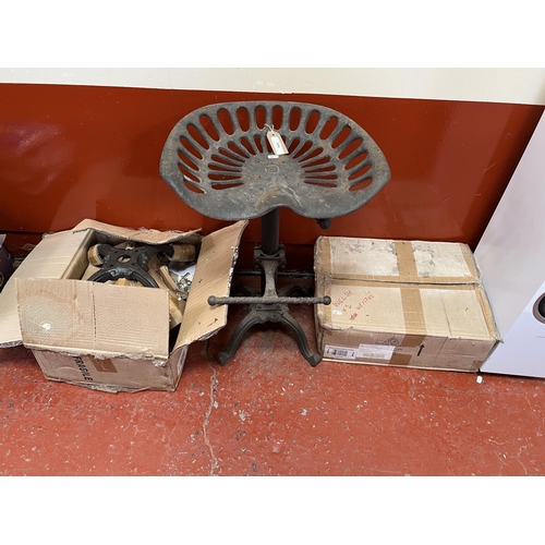 391 - A cast iron adjustable tractor seat bar stool together with two others (still boxed)