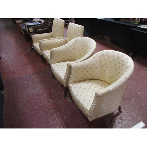 230 - A pair of vintage tub chairs upholstered in gold coloured flower and ribbon design fabric together w... 