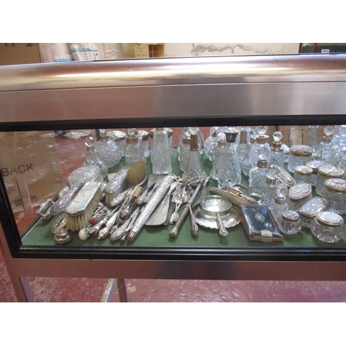 247 - An enormous collection of nineteenth century and other silver mounted perfume and powder bottles, dr... 