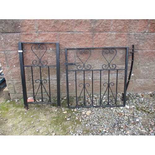 24 - A black painted wrought iron gate to fit aperture 147cm