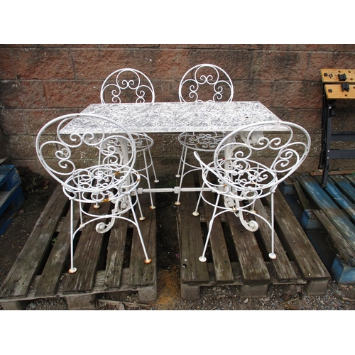 31 - A metallic ornate rectangular table with four chairs all finished in white