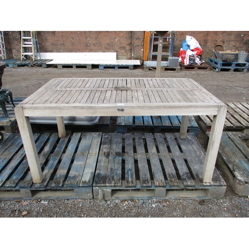 63 - A teak garden table