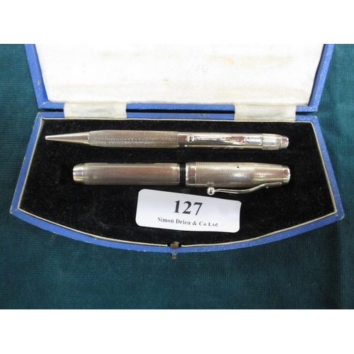 127 - A sterling silver propelling pencil and sterling silver fountain pen set