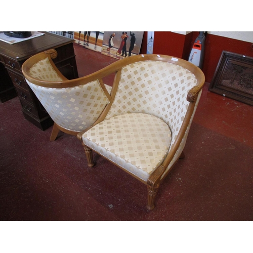 189 - A love seat upholstered in neutral coloured and gilded diamond design fabric