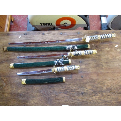 199 - A set of three graduated Samurai swords