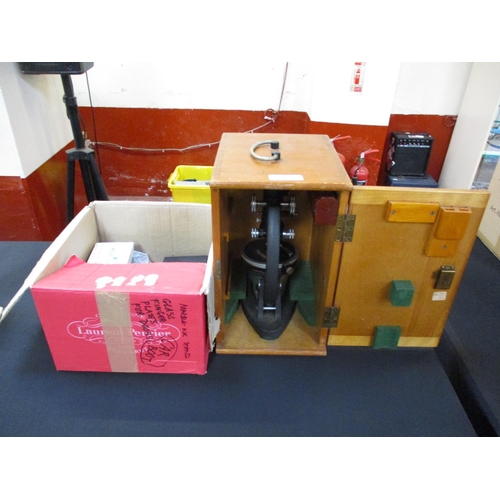 202 - A laboratory microscope and fitted box together with associated accessories